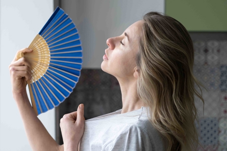 woman using a fan